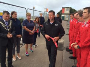 Ben Murphy of the Blades Aerobatic team steps up to tie his ribbon