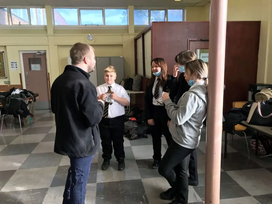 students and JET volunteers in a school